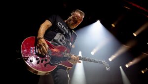 Peter Hook plays guitar